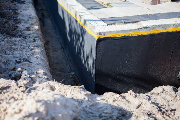 Professional Basement Waterproofing technician working in Baltimore, OH